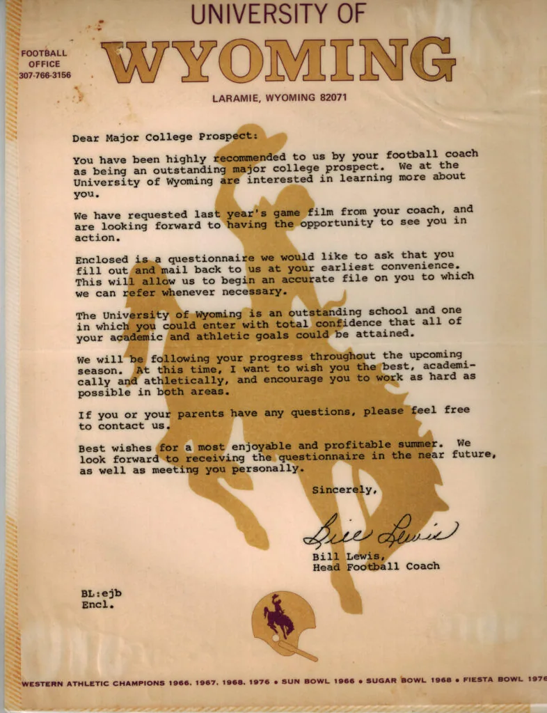 University of Wyoming Football Office letterhead with typed recruitment letter to a major college prospect, signed by Bill Lewis, Head Football Coach, dated from early 1980s era